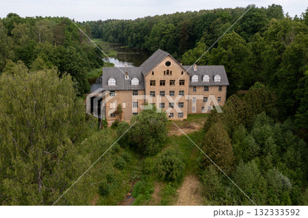 The ancient Katrina mill building in a picturesque location by the lake, Krimulda, Latvia 132333592