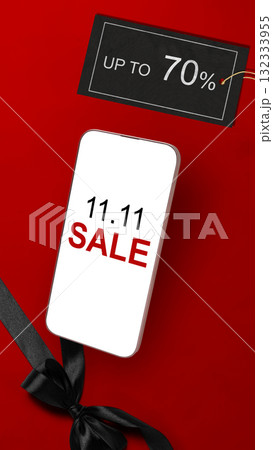 11.11 sale text on cellphone screen with up to 70% text on the label tag. Copy space. Flash sale concept 11.11 sale text on cellphone screen with up to 70% text on the label tag. Copy space. Flash sale concept 132333955