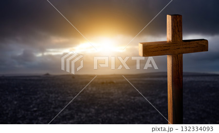 Christian cross with landscape view and dark dramatic sky background. Concept of Christianity, religious, faith, Jesus, or belief Christian cross with landscape view and dark dramatic sky background. Concept of Christianity, religious, faith, Jesus, or belief 132334093