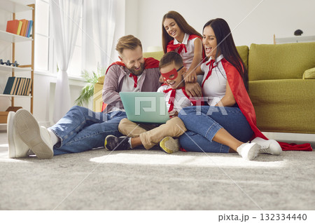 Superhero Family Bonding with Laptop at Living Room Superhero Family Bonding with Laptop at Living Room 132334440