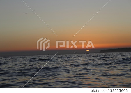 Golden Sunset Over Atlantic Ocean in Algarve, Portugal 132335603
