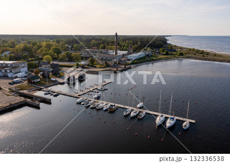 Aerial view of yachts at the pier of a seaside fishing village, Engure, Latvia Aerial view of yachts at the pier of a seaside fishing village, Engure, Latvia 132336538