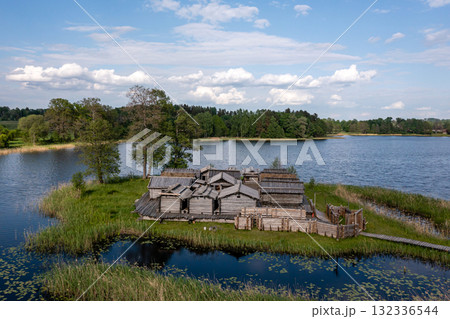 view from above of ancient wooden settlement on river island, recontruction of ancient architecture 132336544