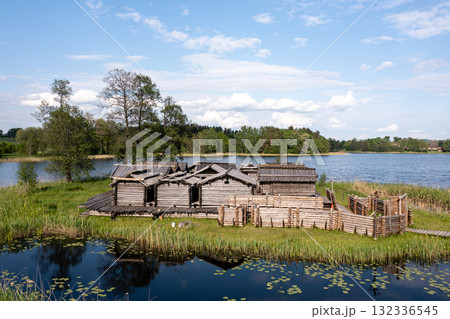 view from above of ancient wooden settlement on river island, recontruction of ancient architecture 132336545