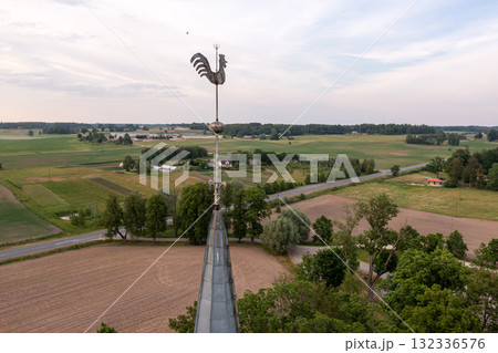 Krimulda Evangelical Lutheran Church tower with rooster, close-up, Latvia, drone view Krimulda Evangelical Lutheran Church tower with rooster, close-up, Latvia, drone view 132336576
