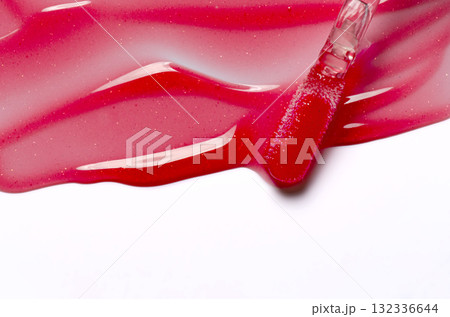 Lip oil, liquid red lipstick. Cosmetic product for lip moisturizing. Copy space 132336644