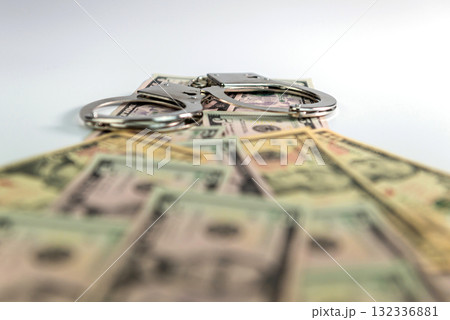 handcuffs on money background, dollar bills, money cash corruption, dirty money, police handcuffs handcuffs on money background, dollar bills, money cash corruption, dirty money, police handcuffs 132336881