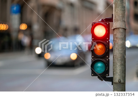 traffic light on the street junction with beautiful bokeh, city with cars in the background traffic light on the street junction with beautiful bokeh, city with cars in the background 132337354