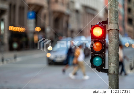 traffic light on the street junction with beautiful bokeh, city with cars in the background 132337355