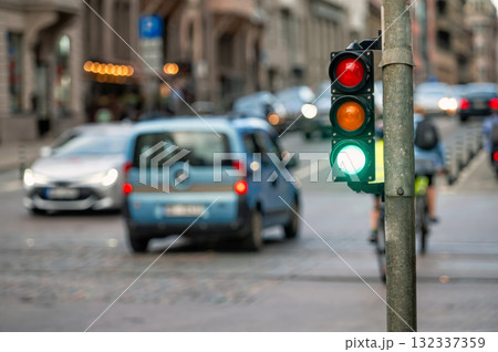 traffic light on the street junction with beautiful bokeh, city with cars in the background traffic light on the street junction with beautiful bokeh, city with cars in the background 132337359