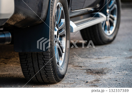 Closeup of parked car on a city street side 132337389