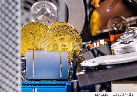 closeup of gold bitcoin on computer components background, technology and digital currency concept closeup of gold bitcoin on computer components background, technology and digital currency concept 132337422