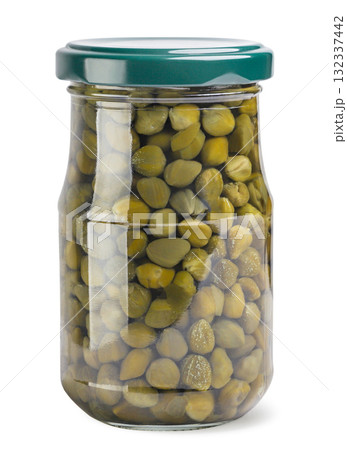 Pickled capers in a glass jar on a white background. Isolated 132337442