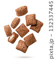 Chocolate corn pads flying on a white background. Isolated 132337445
