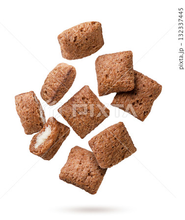 Chocolate corn pads flying on a white background. Isolated Chocolate corn pads flying on a white background. Isolated 132337445