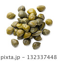 Pile of pickled capers on a white background. Top view 132337448