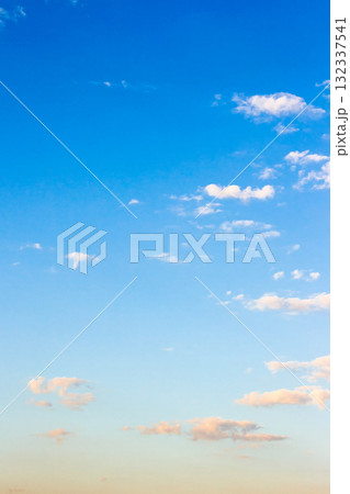 blue sky on a sunny august day. dynamic cloud formations in morning light. windy weather forecast in summer. nature photo for background and compositing 132337541