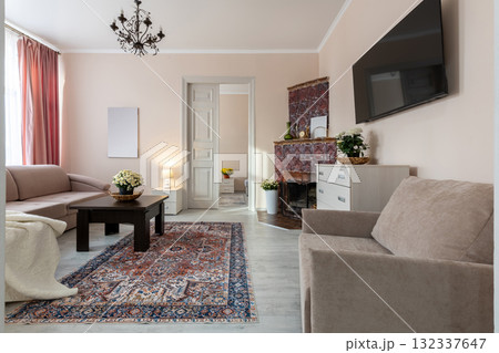 Cozy Living Room with Fireplace and Elegant Decor Cozy Living Room with Fireplace and Elegant Decor 132337647