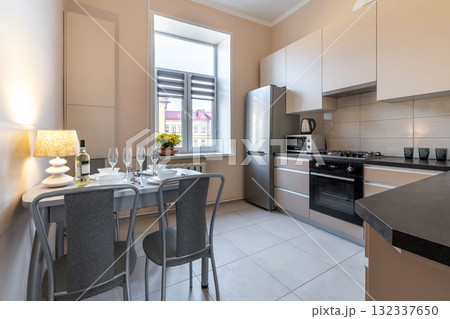 Bright Modern Kitchen with Dining Table and Window View Bright Modern Kitchen with Dining Table and Window View 132337650