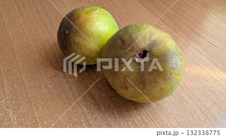 Assorted Fresh Fruits Beautifully Arranged on a Wooden Table for a Vibrant Autumn Display Assorted Fresh Fruits Beautifully Arranged on a Wooden Table for a Vibrant Autumn Display 132338775