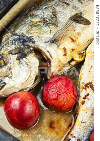 Whole fried dorado in baking sheet. Whole fried dorado in baking sheet. 132338874