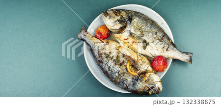 Oven-roasted fish served with plums. Oven-roasted fish served with plums. 132338875