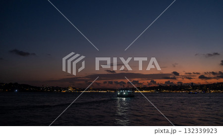 Bosphorus twilight boat cruise revealing city lights and colors at dusk 132339923