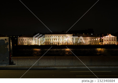 Evening view of illuminated architecture along the river in Saint Petersburg with reflections on the water Evening view of illuminated architecture along the river in Saint Petersburg with reflections on the water 132340884