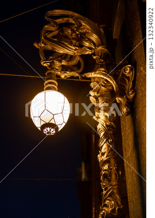 Decorative lamp detail on a historic building in St Petersburg showcasing intricate design at night Decorative lamp detail on a historic building in St Petersburg showcasing intricate design at night 132340922