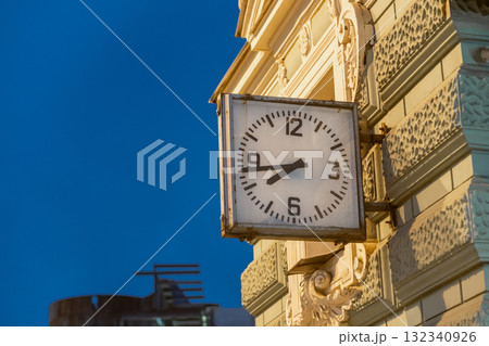 Clock on historic building in St. Petersburg captures evening light and reflects local architecture 132340926
