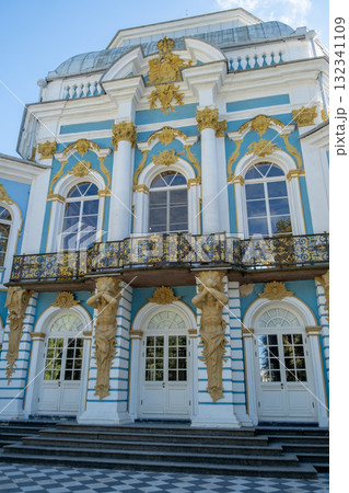 Exploring the grandeur of Catherine Palace with intricate architecture and lush gardens in Tsarskoye Selo on a clear sunny day 132341109