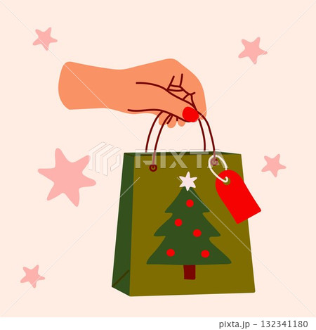 Festive holiday gift bag with Christmas tree design and red tag Festive holiday gift bag with Christmas tree design and red tag 132341180