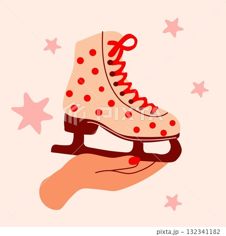 Hand holding colorful ice skate with red dots and laces Hand holding colorful ice skate with red dots and laces 132341182