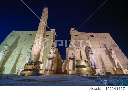 Luxor Temple Entrance with Obelisk and Statues Illuminated at Night Egypt. Luxor Temple Entrance with Obelisk and Statues Illuminated at Night Egypt. 132343337