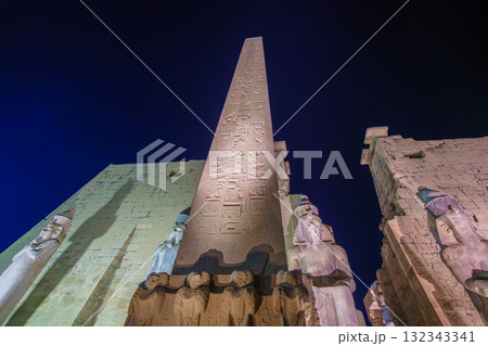 The Great Obelisk and Colossal Pillars of Luxor Temple Egypt Under Night Sky. The Great Obelisk and Colossal Pillars of Luxor Temple Egypt Under Night Sky. 132343341