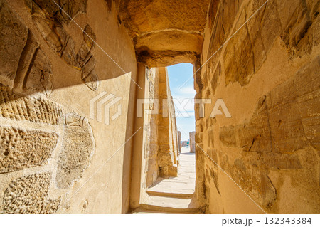 Ancient passage in Temple of Karnak Luxor Egypt leading to bright outside. 132343384