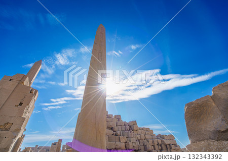 Obelisk and Sunlight at Temple of Karnak Luxor Egypt Ancient Sacred Symbol. Obelisk and Sunlight at Temple of Karnak Luxor Egypt Ancient Sacred Symbol. 132343392