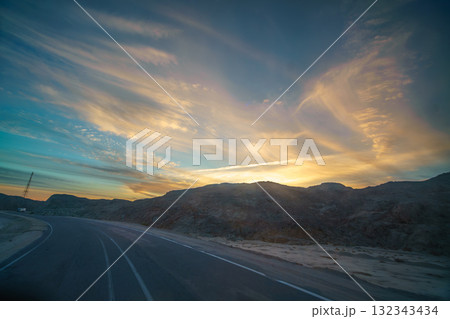 Twilight Road Journey past Hills and Powerline near Hurghada (Red Sea) Egypt. 132343434