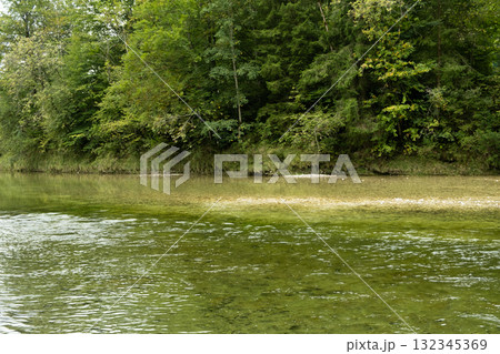 Peaceful River Flowing Calmly Through Valley 132345369