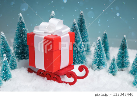 Festive winter display, Seasonal winter setting showcasing tiny gifts against snowcovered backdrop 132345446