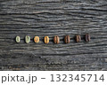 Color roast level of green coffee bean to dark roasted bean on wooden board. top view. 132345714
