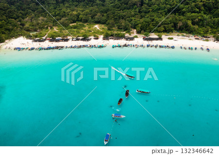 Bird's eye view of Redang Island with a tropical beach and tourist boats off the coast 132346642