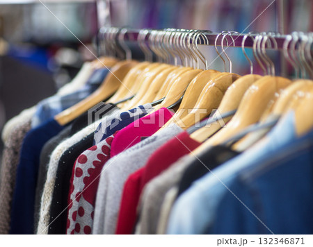 Fashionable clothes on hangers in a store 132346871