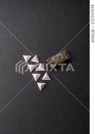 Anti-tank barrier or dragon's teeth made of concrete and iron as a fortification. Dragon's teeth 132347039