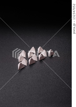 Anti-tank barrier or dragon's teeth made of concrete and iron as a fortification. Dragon's teeth Anti-tank barrier or dragon's teeth made of concrete and iron as a fortification. Dragon's teeth 132347052