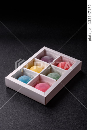 Japanese mochi, ice cream or Asian sweets with fruit filling. Mochi of different colors 132347179
