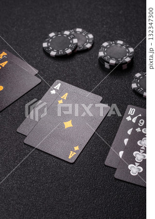 Playing blackjack or baccarat card game in casino with chips, bets and risk. Cards and chips Playing blackjack or baccarat card game in casino with chips, bets and risk. Cards and chips 132347300