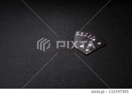 Playing card game poker in casino with chips, bets and risk. Cards and chips Playing card game poker in casino with chips, bets and risk. Cards and chips 132347305