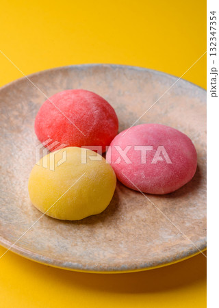Japanese mochi, ice cream or Asian sweets with fruit filling. Mochi of different colors 132347354