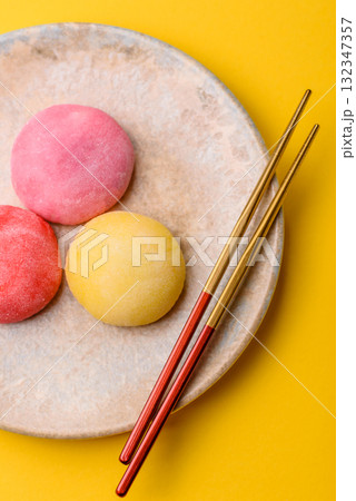 Japanese mochi, ice cream or Asian sweets with fruit filling. Mochi of different colors 132347357
